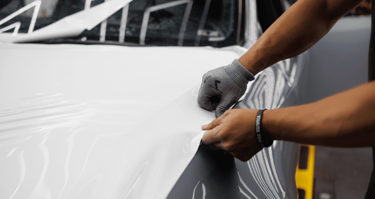 Automotive tapes placed onto a cars wrap.