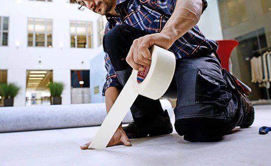 Double-sided paper tapes applied to the floor outside