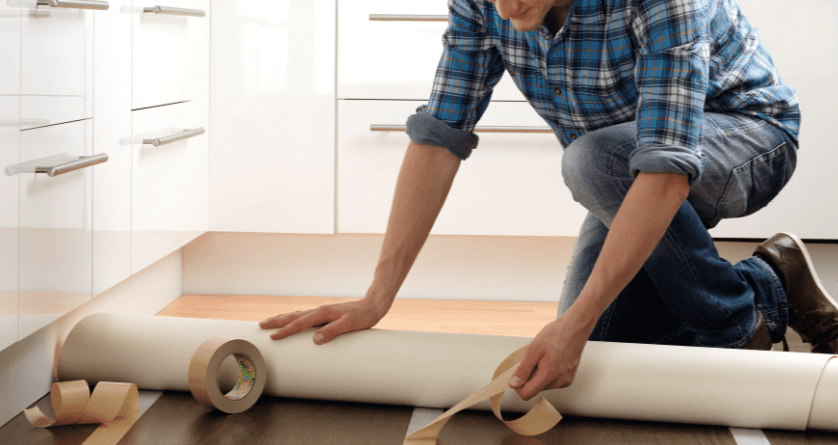 Doule-sided vinyl tape placed inside on a floor for a carpet.